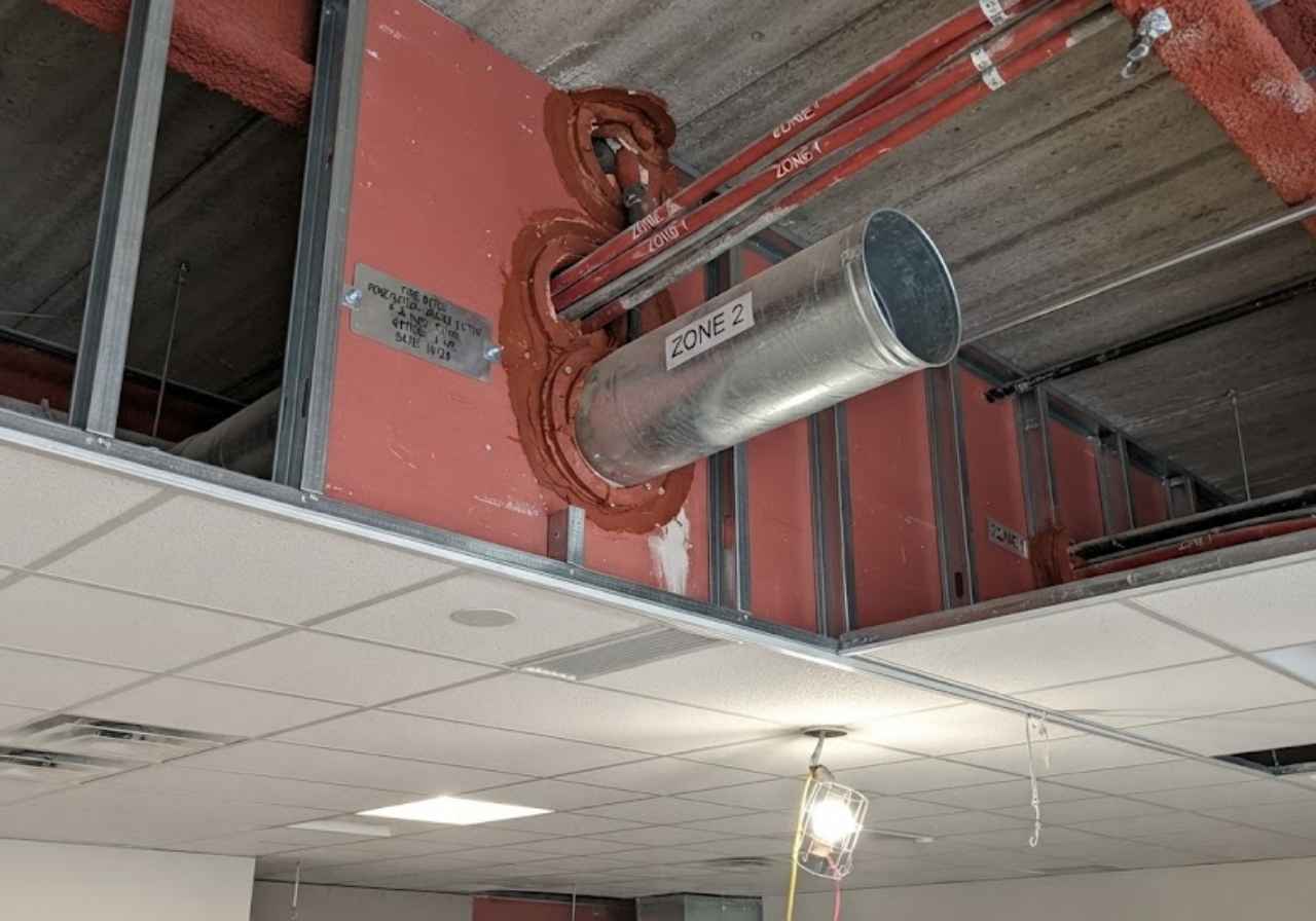 Sealed zone wall above a Denver casino ceiling line