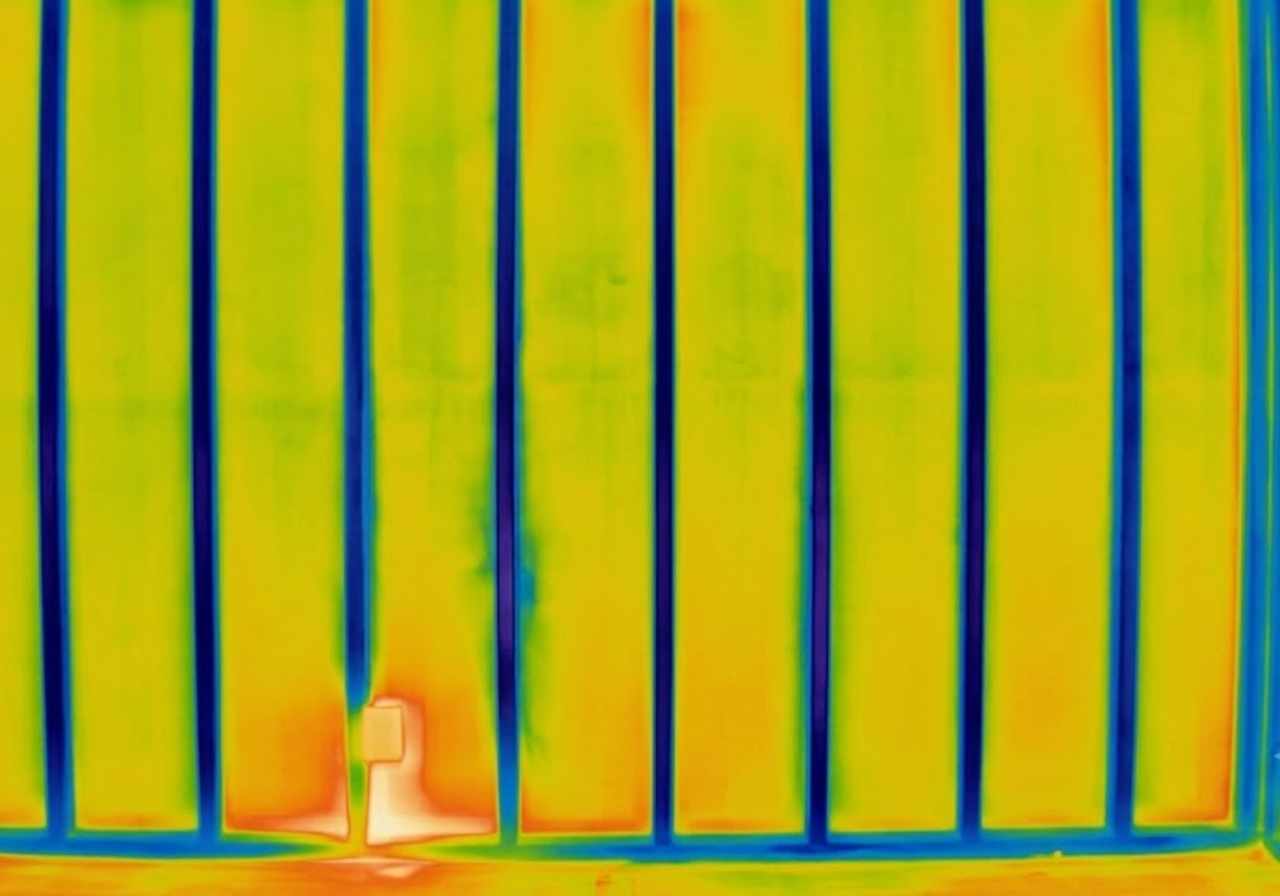 Thermal image of heat loss through 2x4 wall studs