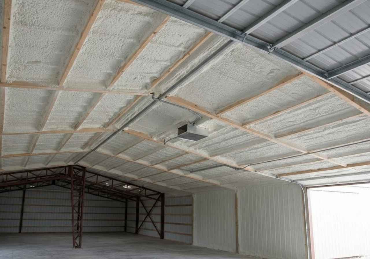 Closed-cell spray foam on pole barn roof steel in Colorado